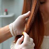 Expert applying hair colour in the salon