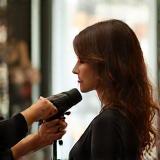 Stylist creating signature blowout